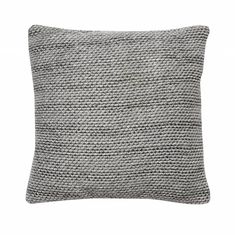 a gray pillow on a white background