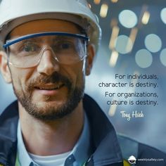 a man wearing safety goggles and a hard hat with a quote on the side