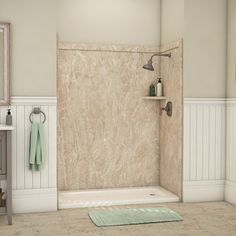 a bathroom scene with focus on the bathtub and shower head, rugs and towels