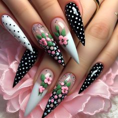 "Stunning pointed long nails with black and white polka dots, accented by tiny pink and green flowers for a beautifully crafted look." Nails With Black And White, Uñas Coquette, Flower Pattern Nails, Fingernail Ideas, Pattern Nails, Nails With Black, Pink And Green Flowers, Pop Art Nails, Polka Dot Nail Art