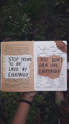 someone holding up a book with writing on it that says stop trying to be even like everybody