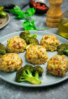 broccoli florets are arranged on a plate next to other food items