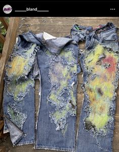 an old pair of jeans that have been dyed with yellow and green paint on them