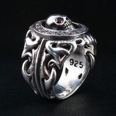 Tribal Garnet Skull 925 Sterling Silver Gothic Ring  Ring width : 7/8" x1" inch  Ring weight : 28 grams   Material:.925 sterling silver   Made of solid sterling silver and featuring a unique design engravings of a skull, this is a one of a kind ring. The center piece skull features two blood red garnet gemstone eyes. Solid and masculine in design, this ring is a must-have for your biker jewelry accessory collection.  It will hold up to years of wear and tear and will handle any road trip you hea Biker Accessories, Ring And Bracelet, Gothic Ring, Biker Jewelry, Gothic Rings, Blood Red, A Skull, Skull Ring, Dream Ring