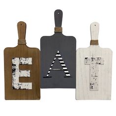 three wooden tags with the letters e, f, and h on them are shown