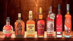 several bottles of alcohol lined up on a table