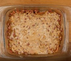 a casserole dish filled with beans and cheese