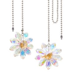 two necklaces with flowers hanging from chains on a white background, one is clear and the other is multicolored