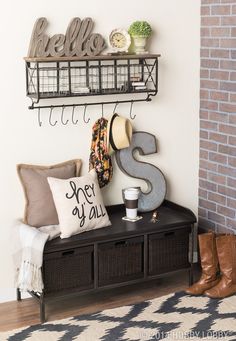 an image of a room with a sign on the wall and a bench in front of it