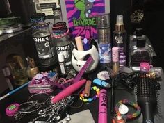 a table topped with lots of different types of personal care products and makeup brushes on top of it