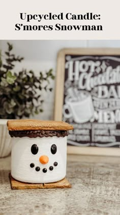 an upcycled candle smores snowman on a table