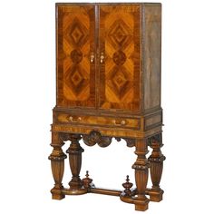 an ornate wooden cabinet with two doors