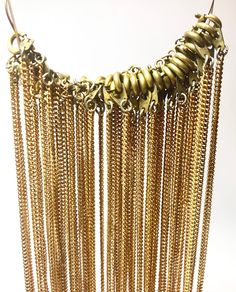 "Description: Gold Tone Vintage Fine Necklaces, Textured Cable Link Chains, finished with round brass clasps (spring ring) Measurements: 16\" long, chain width measures about 1/16th inch Quantity in Lot: 34 necklaces   This listing is for a lot of 34 delicate, gold-tone necklace chains that feature round brass clasps for closure. These supplies are are a bit tarnished, giving them a rustic and truly  Vintage look==and may show some signs of tarnishing but clean up easily. Costume Jewelry Finding Bronze Brass Chain Jewelry, Bronze Brass Jewelry With Chain, Brass Box Chain Necklace, Antique Gold Brass Chain Jewelry, Round Chain Necklace With Adjustable Chain, Brass Chain Necklace With Lobster Clasp, Brass Dangle Chain Necklaces, Bronze Adjustable Chain Necklace In Brass, Long Brass Chain Necklace