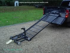 a truck with a ramp attached to the back of it