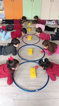 children sitting on the floor playing with toys