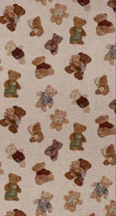 a group of teddy bears sitting on top of a rug