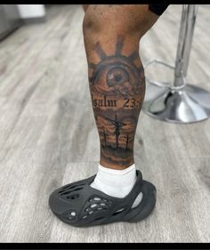 a person with a tattoo on their leg