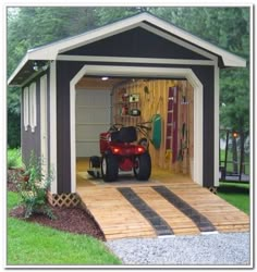 a small garage with a motorcycle in it