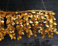 gold leaf chandelier hanging from the ceiling