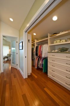 the closet is clean and ready to be used for clothing storage, as well as other items