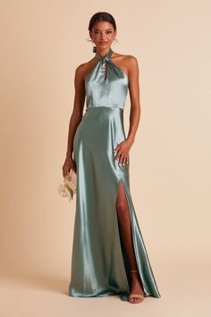 Your wedding will look like a star-studded event with your bridal party wearing this twist-front halter satin bridesmaid dress. Available in Sea Glass. Hollywood glam. | Sea Glass Bridesmaid Dress Shiny Satin Size XS | Birdy Grey Monica Monica Dress, Satin Gowns, Satin Bridesmaid Dress, Twist Front Dress, Birdy Grey, Satin Dress Long, Green Bridesmaid, Bridesmaid Dress Colors, Green Bridesmaid Dresses