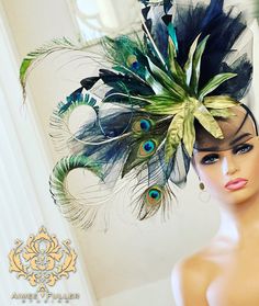 Dazzle at your big event with this show-stopping, peacock-feather extravaganza! We wanted to create something that would celebrate these beautiful, natural wonders! Handmade headband fascinator with large a medley of exciting feathers. Looks elegant and beautiful from all angles. Surprisingly light-weight for how big it is. MADE TO ORDER. *FREE SHIPPING Handmade by Aimee Fuller in Southern California Aimee Fuller has been a trusted online seller since 1999, and is excited to bring her creations back to Etsy.  Though often copied by hobbyists and even high-end department stores, discriminating fashionistas from all walks of life count on Aimee's pieces to lead the trends and make one-of-a-kind statements in their ensembles, fashion shoots, and style shows. You can also see her designs on ev Luxury Ostrich Feather Headpiece For Kentucky Derby, Luxury Ostrich Feather Hats For Kentucky Derby, Kentucky Derby Ostrich Feather Fascinator, Peacock Derby Hat, Kentucky Derby Party Hats, Peacock Feather Fascinator, Feathered Hats For Kentucky Derby And Western-themed Events, High Tea Wedding, Luxury Hat-shaped Fascinator For Races