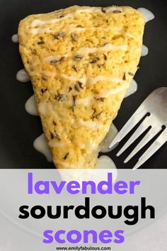 a piece of bread on a plate with a fork and knife next to it that says lavender sourdough scones