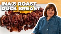 a woman standing in front of a plate of food with meat on it and the caption ina's roast duck breast