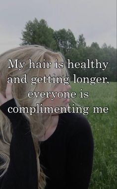 a woman sitting in the grass with her hand on her head and text that reads, my hair is healthy and getting longer, everyone is complimenting me