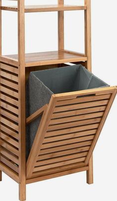 a wooden shelf with a bin on the bottom and a grey fabric bag in it