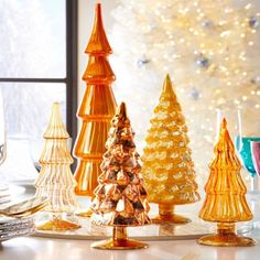 Colorful and elegant, our decorative glass Christmas trees come in a rainbow of coordinating hues.  

Set of 5 glass Christmas trees in assorted sizes.

#holidaydecor #homedesign
#homestyling

We find and curate, we style and bundle, and with one -click & we ship! Visit https://nestset.com/products/glass-christmas-tree-sets Tree Display Ideas, Glass Christmas Trees, Latest Decorating Trends, Tree Display, Cody Foster, Rainbow Tree, Playful Decor, Christmas Tree Set, Tabletop Christmas Tree