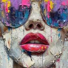 a woman's face with sunglasses and lipstick painted on it