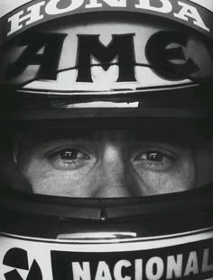 a close up of a person wearing a helmet with words on the side of it