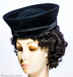 "Rare vintage 40's tilt hat in a soft, velvety feel, black wool felt. No makers mark or name. Noir-Fall/Winter-Mourning Brimless, with a high crown. Back elastic strap with grosgrain ribbon inner band. Decorative black velvet outer band with bow in back. The outer crown is 3 1/4\" high, and the inner crown is appx 3\" high. Diameter at top is appx 8 1/2\" x 8 1/4\" The hat is a size 22. Very good condition for a hat of this age. The velvet ribbon bow in back is a little frayed. There might possi Velvet Ribbon Bow, Tall Crown, Brimless Hat, Black Felt, Velvet Ribbon, Ribbon Bow, Black Wool, Ribbon Bows, Grosgrain Ribbon