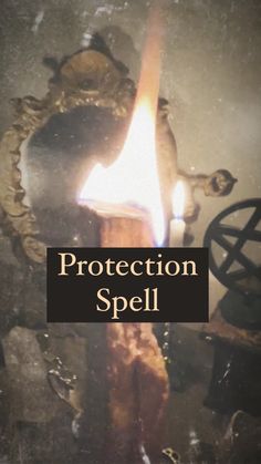 a lit candle with the words protection spell written on it in front of an image