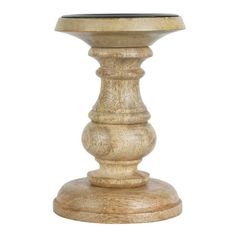 a wooden pedestal with a black top