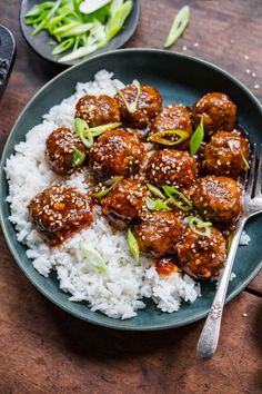 meatballs and rice in a bowl with a fork on the side, ready to be eaten