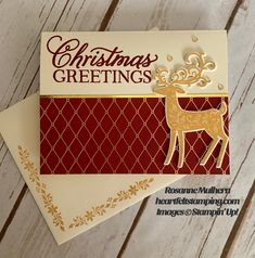 two christmas greetings cards on top of each other, one with a gold reindeer