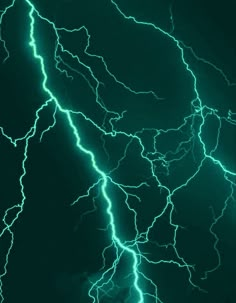 green and white lightning strikes in the night sky