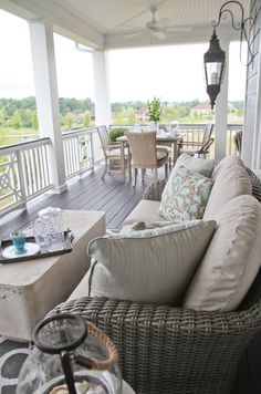 a porch with wicker furniture on it