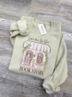 Indulge your literary passion with our "Take Me To The Book Store" Sweatshirt, the ultimate bookish sweatshirt for avid readers and bookworms alike. This funny crewneck is a perfect gift for her, offering a cozy and humorous nod to the world of literature that delights book lovers everywhere. Sand Color Sweatshirt All made by me! Gildan: Heavy Blend * 50% cotton, 50% polyester * Pre-shrunk * Classic fit * 1x1 athletic rib knit collar with spandex * Air-jet spun yarn with a soft feel and reduced Books Shirt, Gifts For A Book Lover, Book Merch, Bookish Sweatshirts, Bookish Crew Neck Sweatshirt As A Gift, Cute Book Sweatshirts, Book Lovers Sweatshirt, Literary Sweatshirt, Bookish T-shirt With Funny Text And Crew Neck