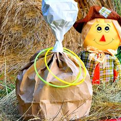 two scarecrows made out of paper bags