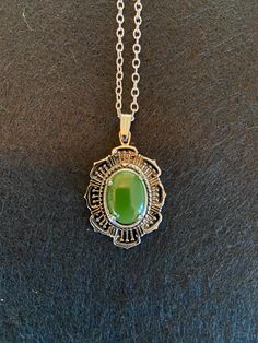 Vintage silver plated Victorian-style pendant featuring one nephrite (or BC) jade cabochon. Nephrite cabochon is 10 mm by 14 mm. Pendant features Victorian-style setting, and is 24 mm wide and 30 mm long. Necklace chain is cable chain style, and is 45 cm long. Nephrite jade is recognizable by its dark olive green, lightly translucent, colour. This jade was sustainably mined in British Columbia, Canada in the mid-1960s. Victorian Boho, Pendant Necklace Vintage, Amulet Necklace, Dark Olive Green, Vintage Victorian, Boho Stil, Necklace Vintage, Victorian Style, Victorian Fashion