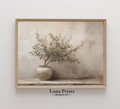 an oil painting of a potted plant in front of a white wall with the words luna prints on it