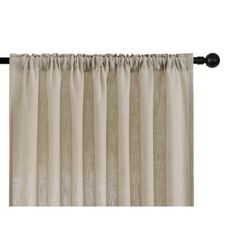 the curtain is closed and ready to be hung in front of a white wall with black hardware