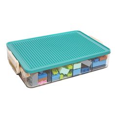 a plastic storage box filled with lots of different colored legos on top of each other