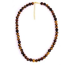 Scale up your accessorized look with the bohemian appeal of this string of stunning tiger's eye beads. Brown Carnelian Gemstone Beaded Necklaces, Brown Carnelian Gemstone Beaded Necklace, Brown Carnelian Large Beaded Necklace, Tigers Eye Beaded Necklace, Tiger Eye Beads, The Bohemian, Eye Beads, Tiger's Eye, Tiger Eye