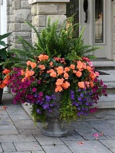 a potted planter filled with lots of flowers