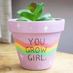 a potted plant with the words you grow girl written on it