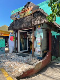 there is a surfboard shop on the side of the street